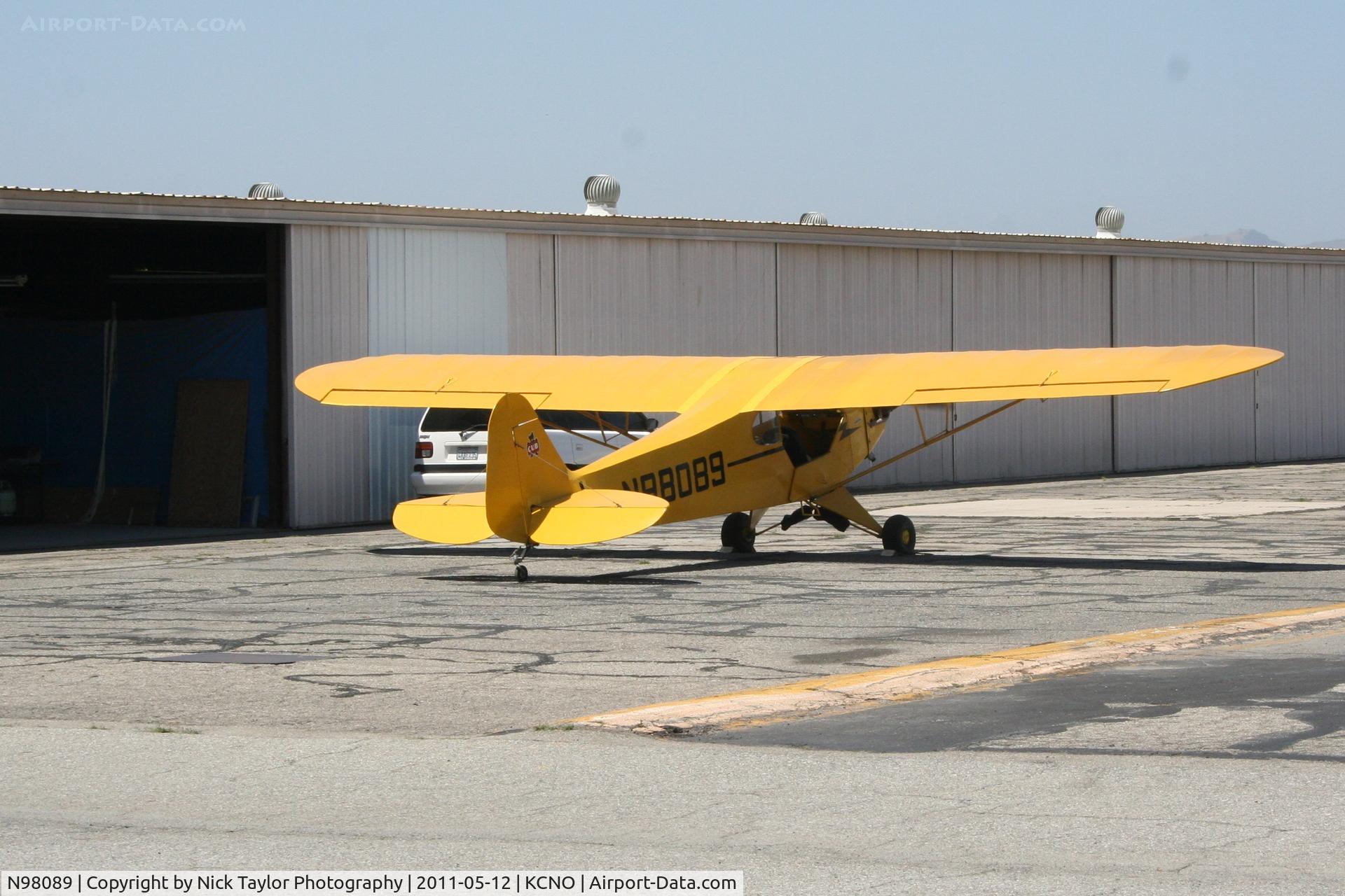 N98089, 1946 Piper J3C-65 Cub C/N 18259, Chocked and engine running with no one at the controls.
