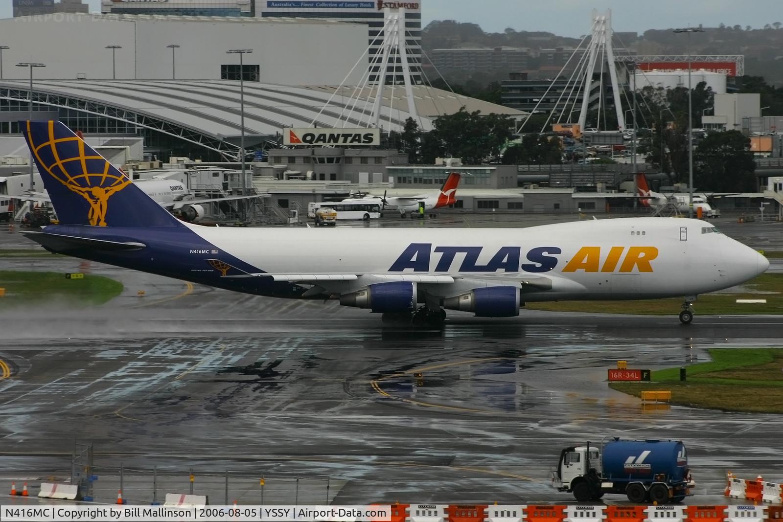 N416MC, 2002 Boeing 747-47UF C/N 32838/1307, onto a wet 16R