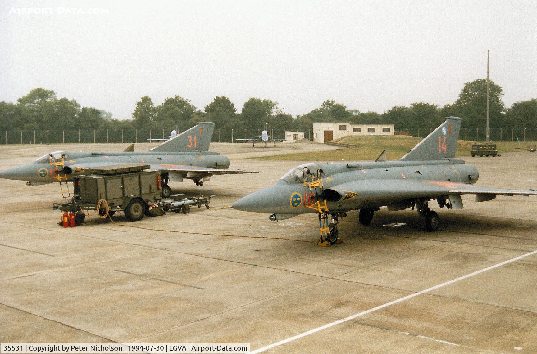 35531, Saab J-35F Draken C/N 35-531, J-35F Draken with companion 35520 of F10 Wing Royal Swedish Air Force on the flight-line at the 1994 Intnl Air Tattoo at RAF Fairford.