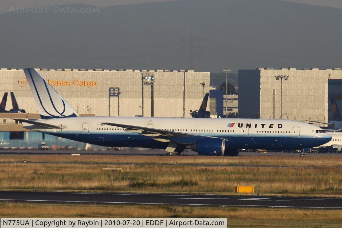 N775UA, 1995 Boeing 777-222 C/N 26947, in the background 3 tails of LH-Cargo MD-11F