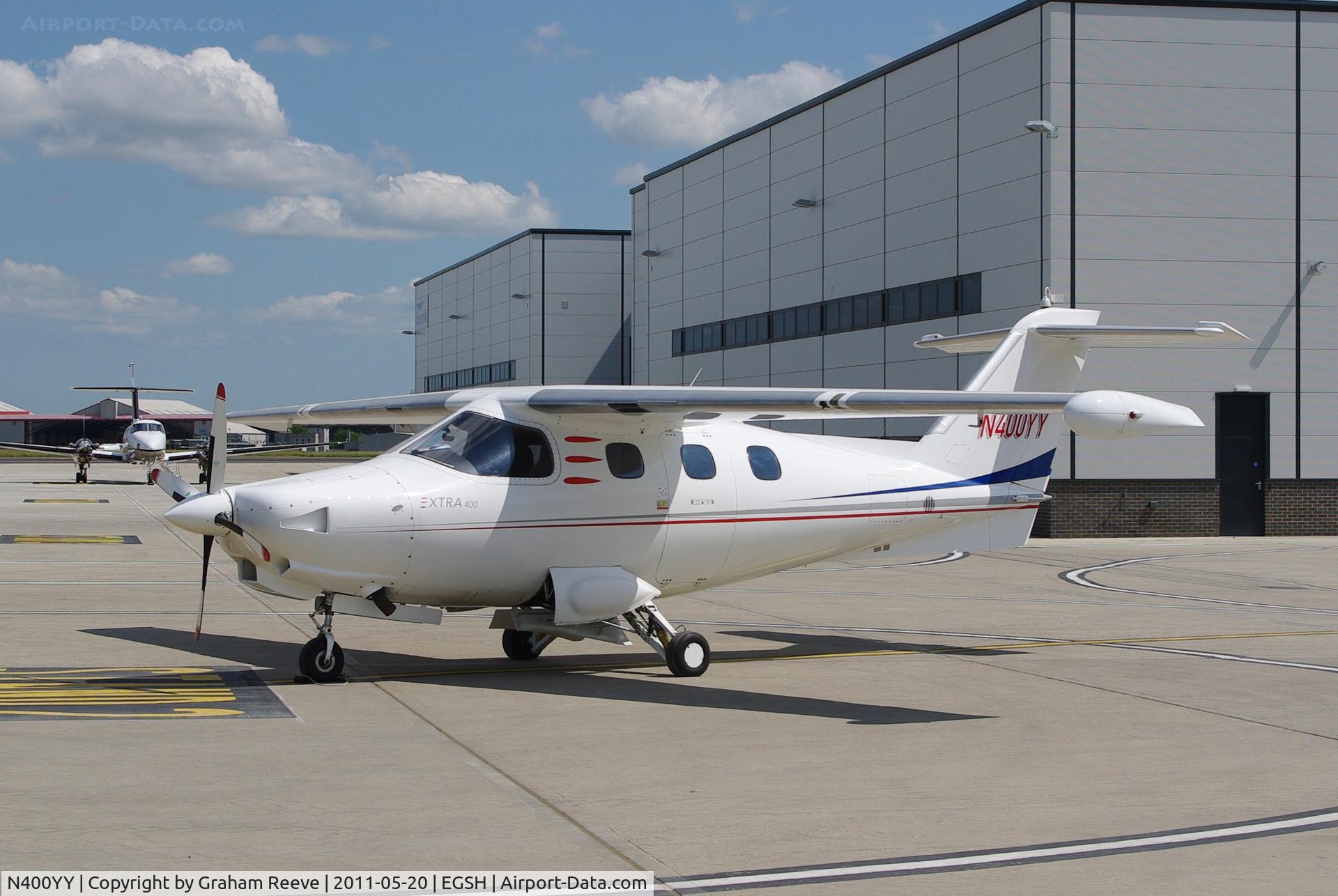 N400YY, 2001 Extra EA-400 C/N 019, Parked in the sun.