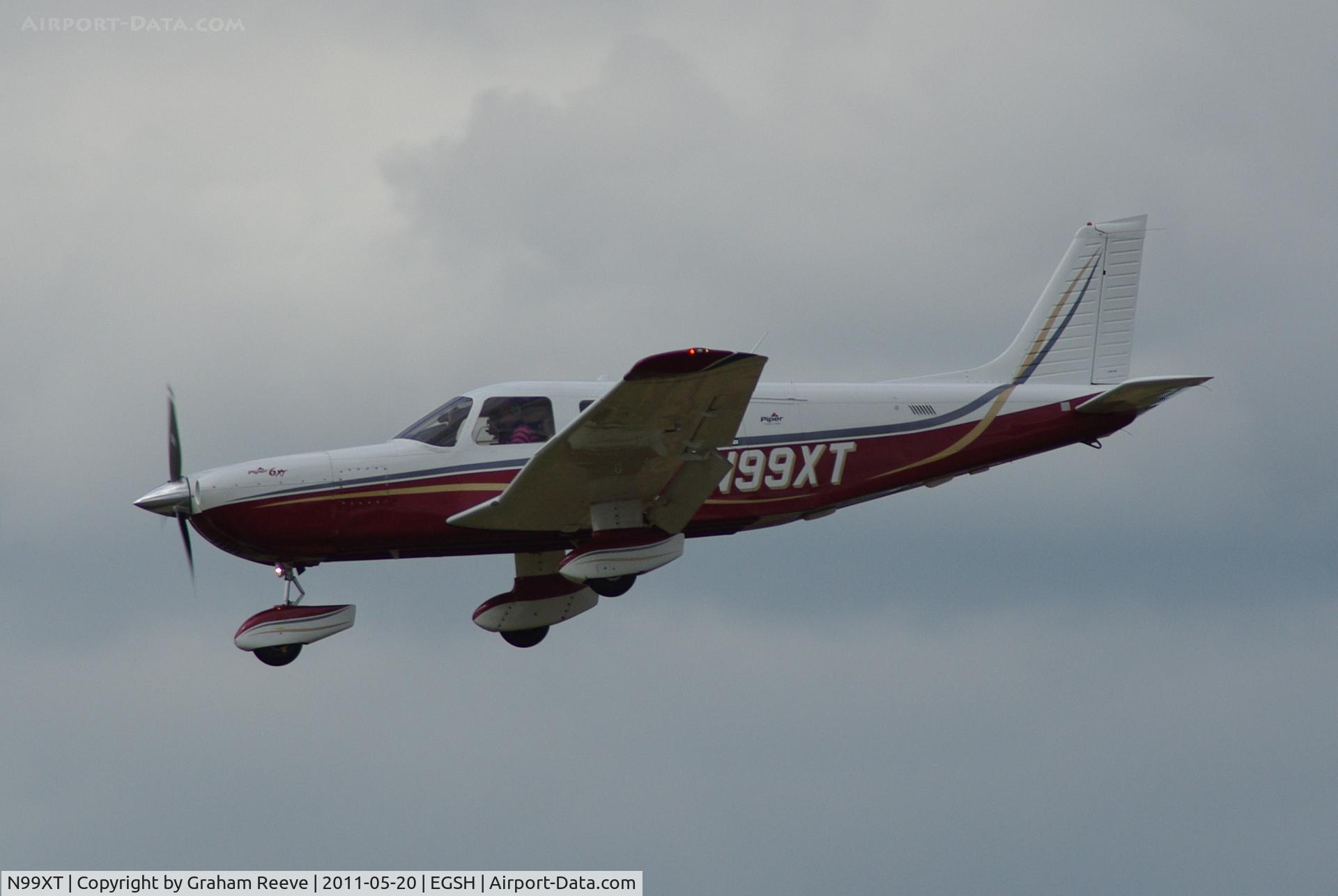 N99XT, 2004 Piper PA-32-301XTC Saratoga C/N 3255024, About to touch down.