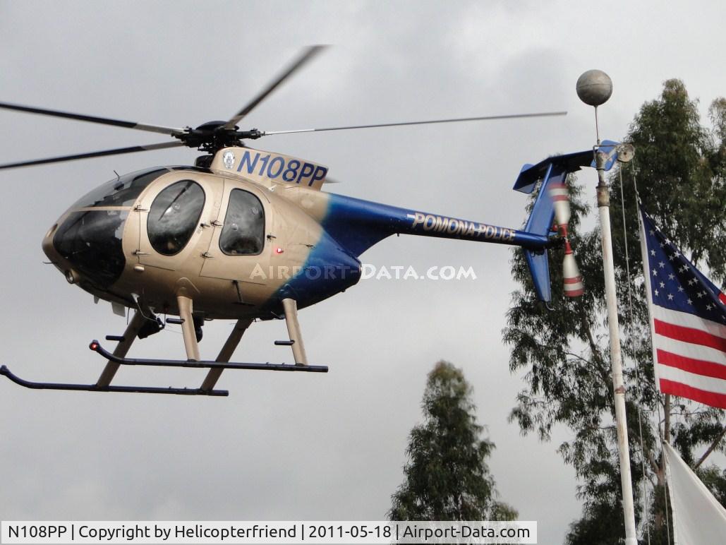N108PP, 2008 MD Helicopters 369E C/N 0578E, Ship passing Old Glory as she settles down onto the street