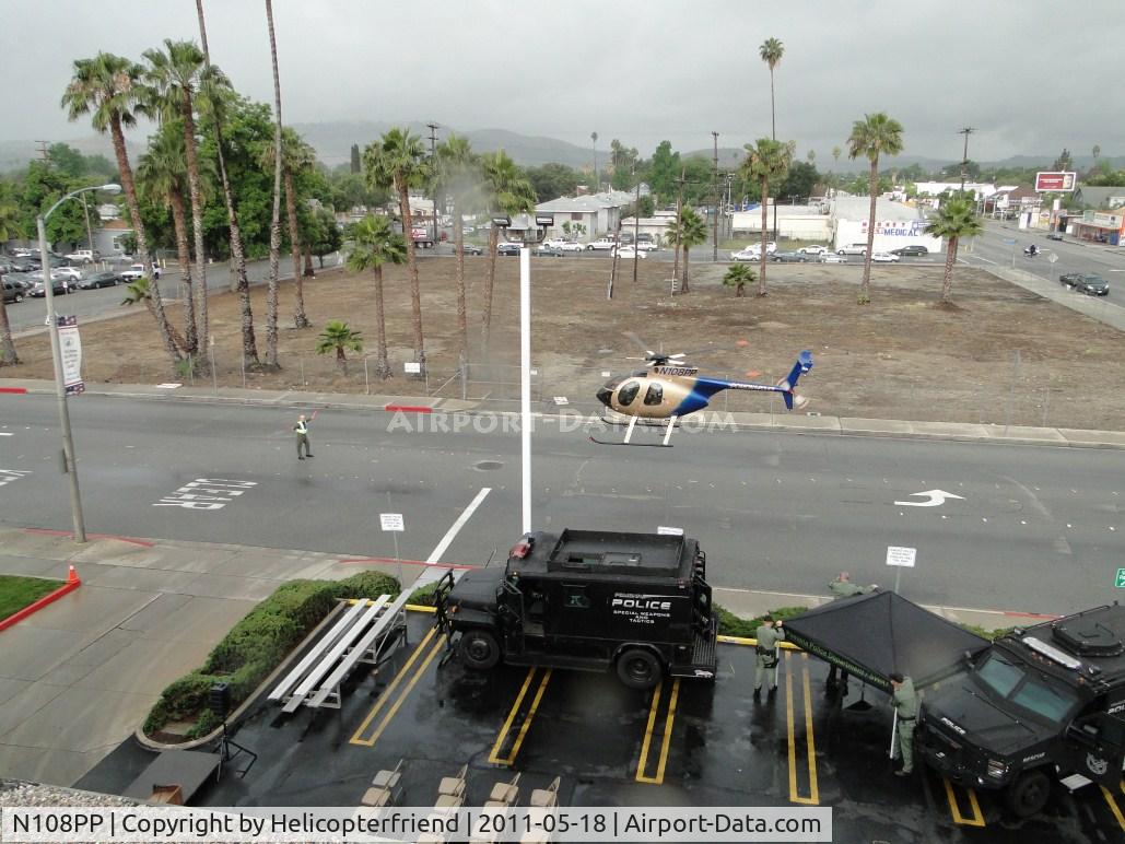 N108PP, 2008 MD Helicopters 369E C/N 0578E, FTO is guiding the pilot to the proper safe parking area for the display