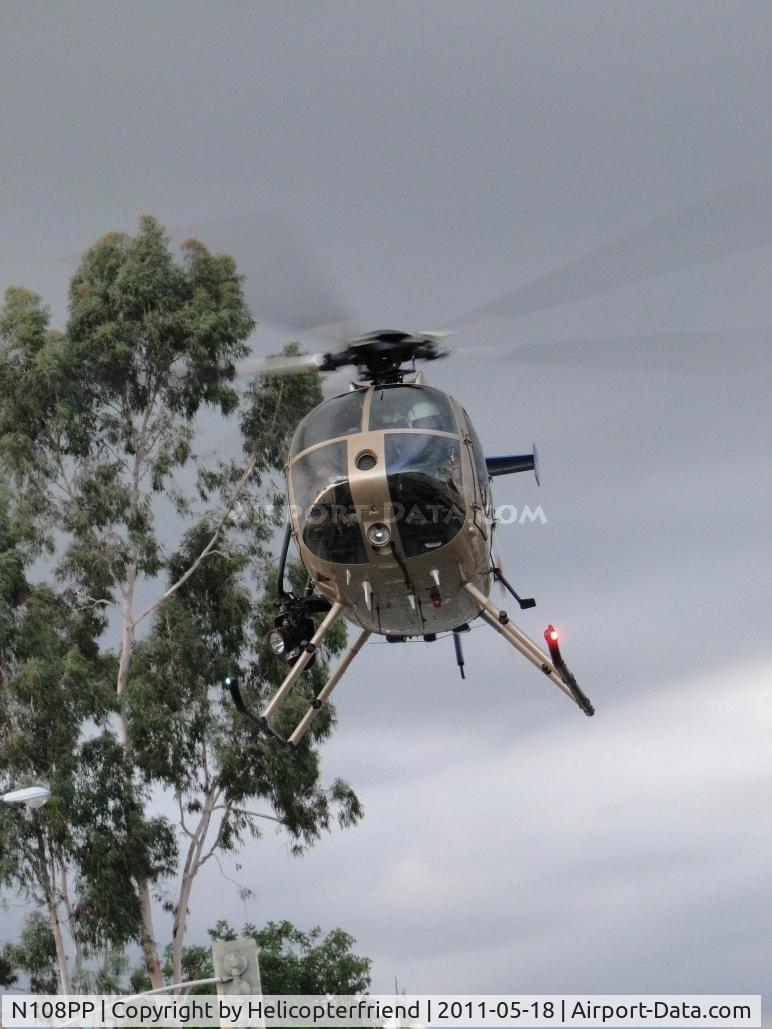 N108PP, 2008 MD Helicopters 369E C/N 0578E, Shows over and she's heading out to go home. Had to go straight up and avoid light poles before leaving the area