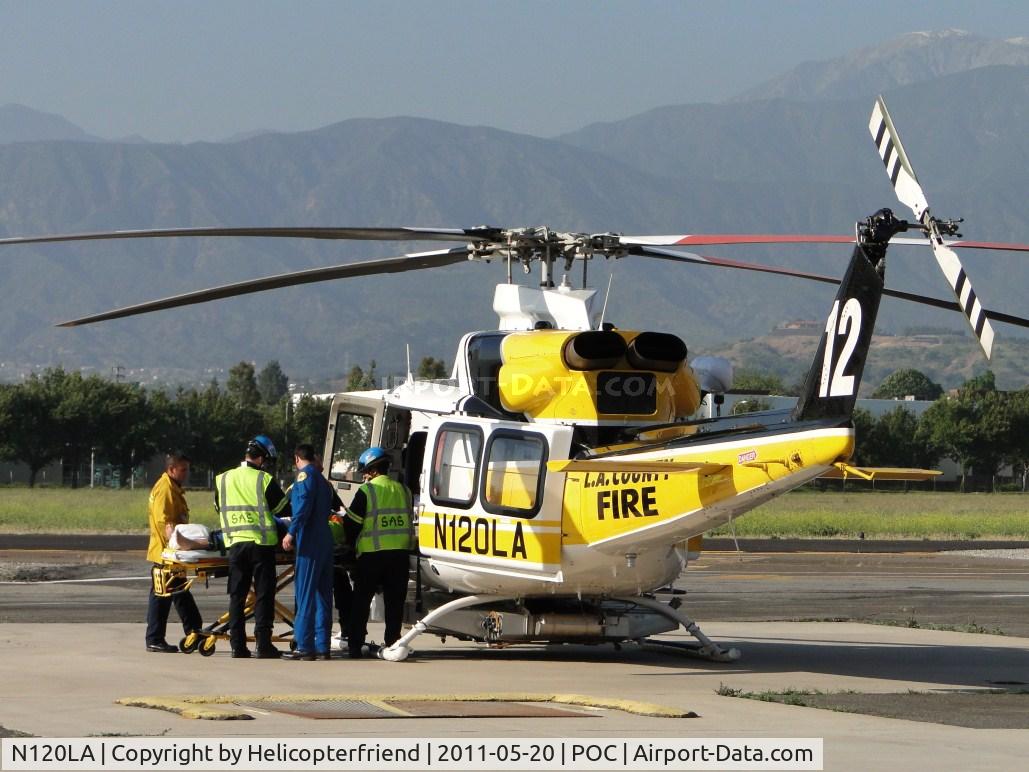 N120LA, 2007 Bell 412EP C/N 36455, Loading up a patient to fly to a trauma center