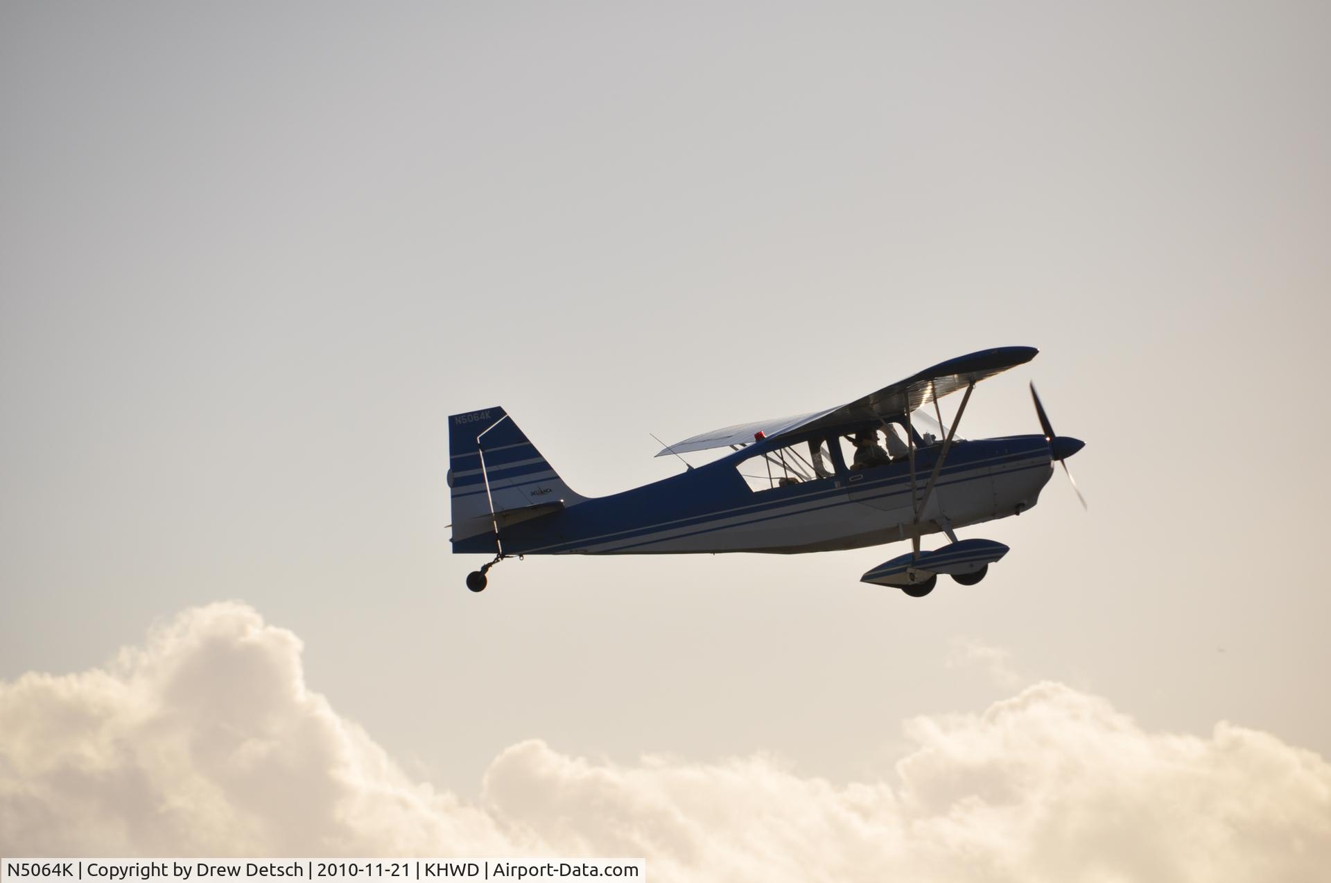 N5064K, 1979 Bellanca 7ECA Citabria C/N 1335-80, Climbing out at Hayward