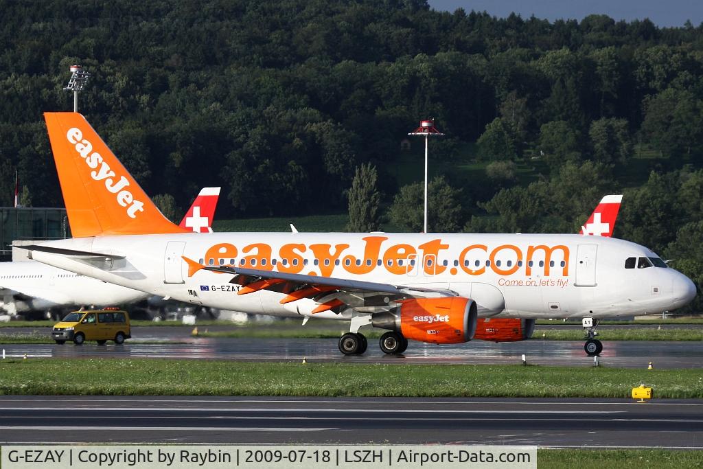 G-EZAY, 2006 Airbus A319-111 C/N 2827, moments after a very heavy rainshower