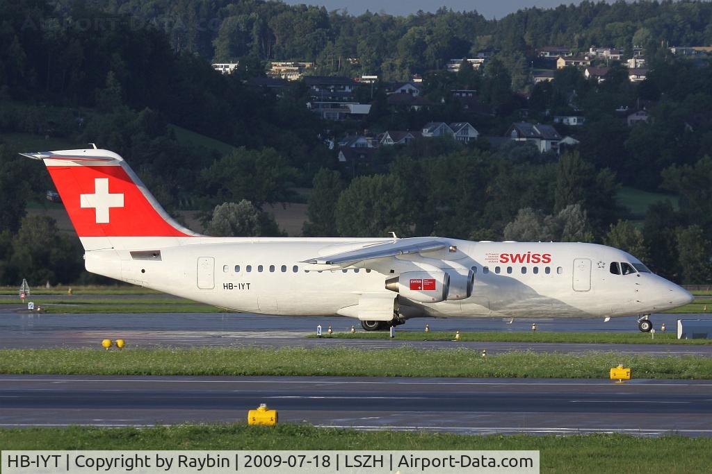 HB-IYT, 2000 British Aerospace Avro 146-RJ100 C/N E3380, evening sun after the rain
