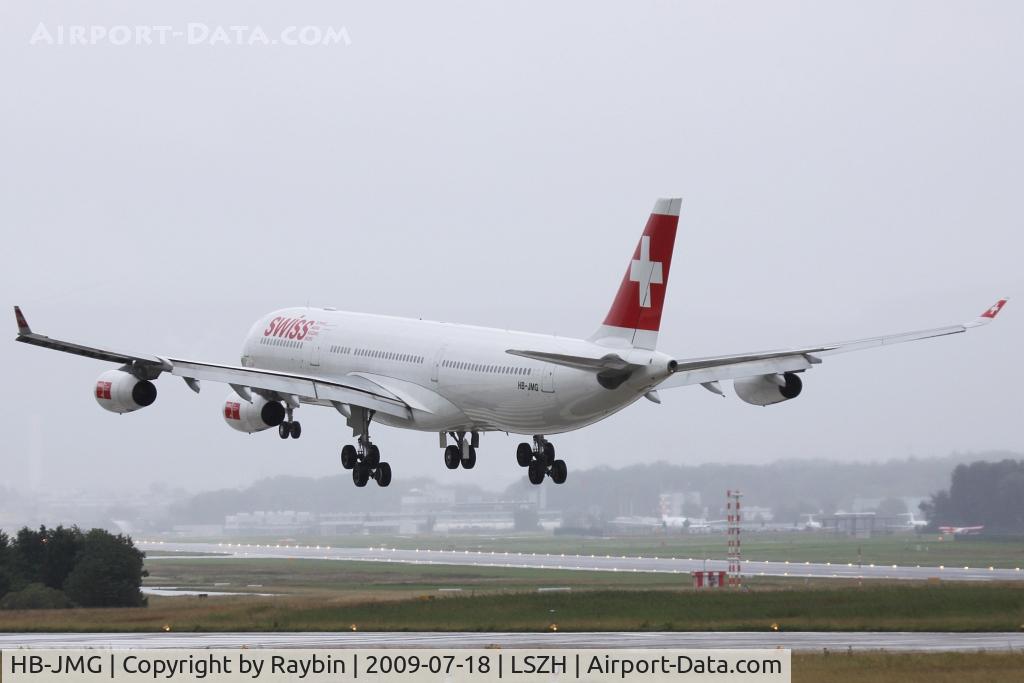 HB-JMG, 2003 Airbus A340-313 C/N 562, morning landing during heavy rain