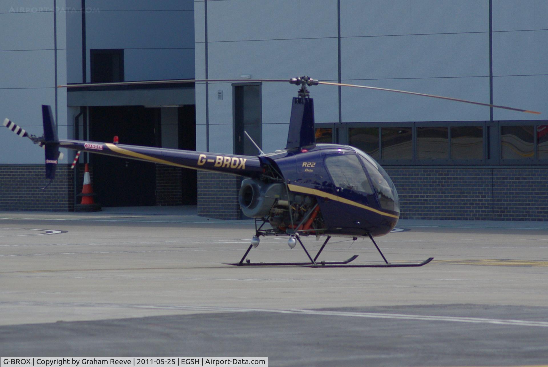 G-BROX, 1989 Robinson R22 Beta C/N 1127, Parked at Norwich.