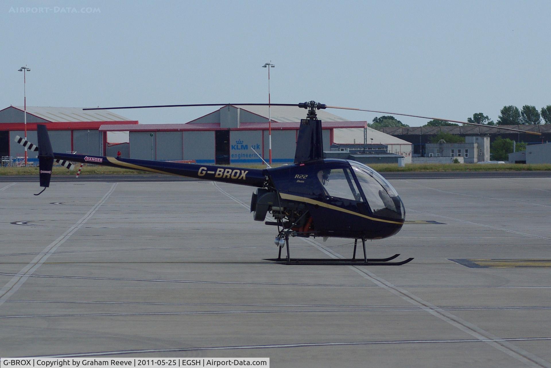 G-BROX, 1989 Robinson R22 Beta C/N 1127, Parked at Norwich.