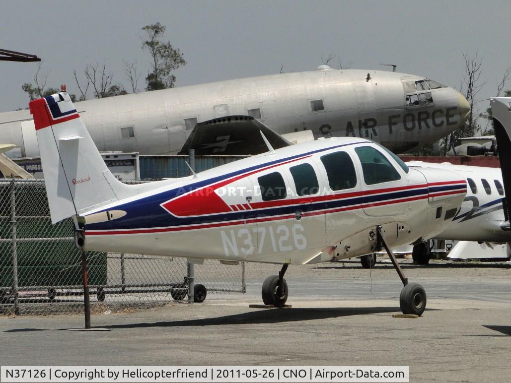 N37126, 1980 Beech A36TC Bonanza 36 C/N EA-156, Wings have been removed and ship parked at paint shop area
