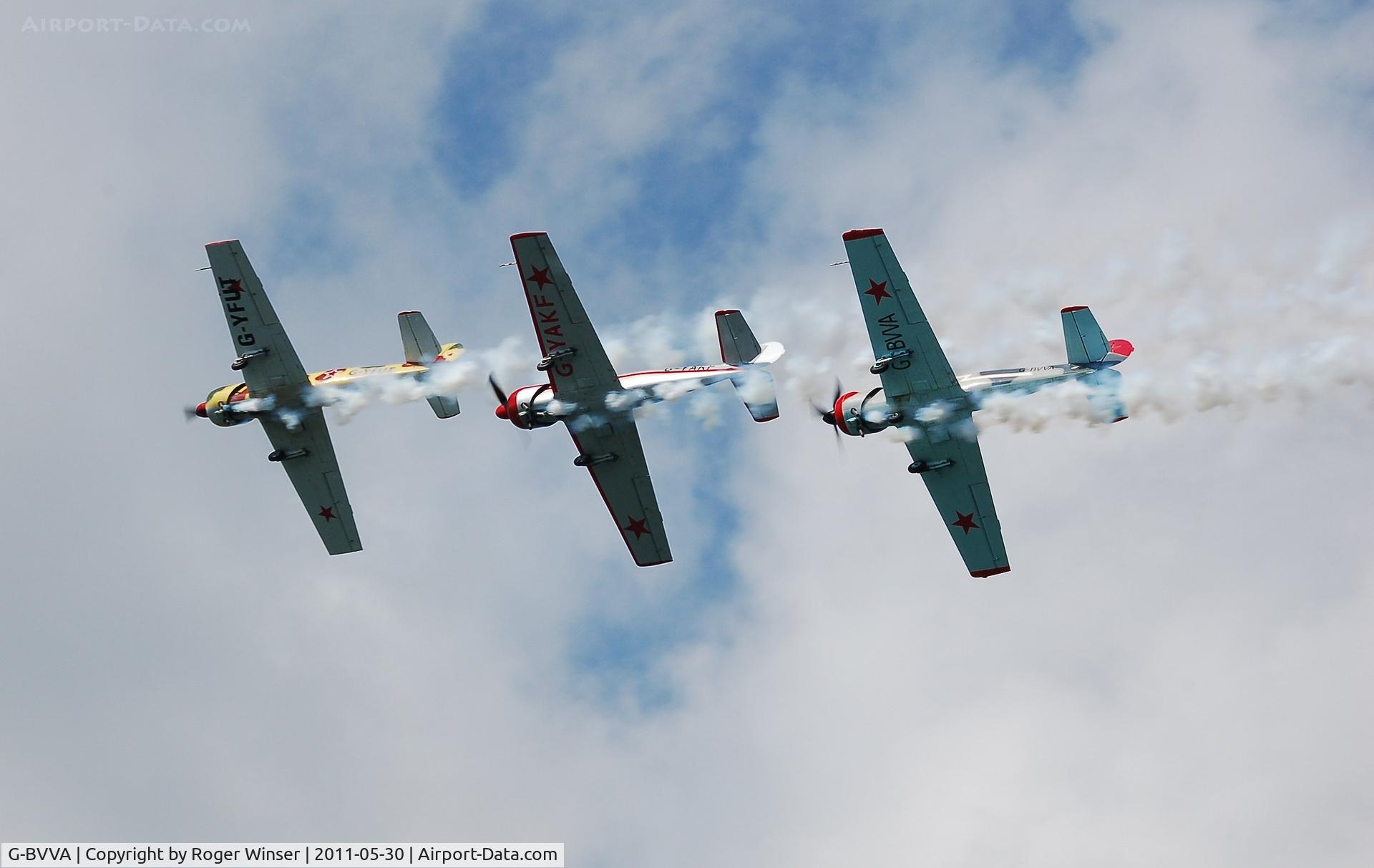 G-BVVA, 1987 Bacau Yak-52 C/N 877610, Off airport. 'Follow the leader' during the Team Osprey display at the Mumbles Navy Days, Swansea Bay, Wales, UK.