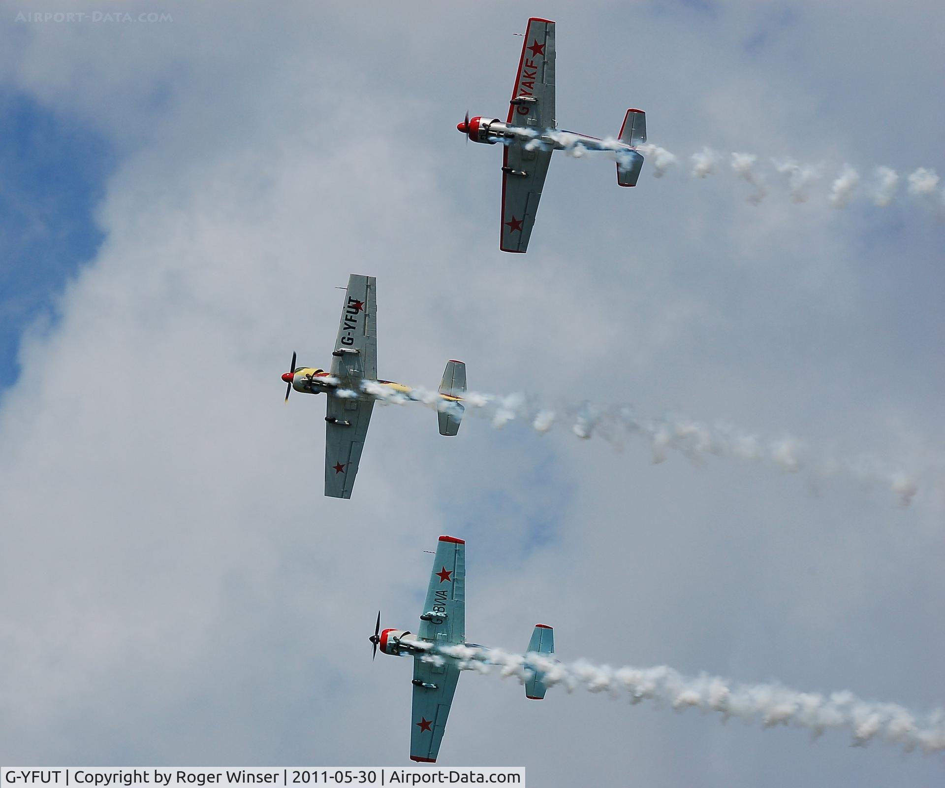 G-YFUT, 1988 Bacau Yak-52 C/N 888410, Off airport. Leading Team Osprey during thier display at the 2011 Mumbles Navy Days, Swansea Bay, Wales, UK.