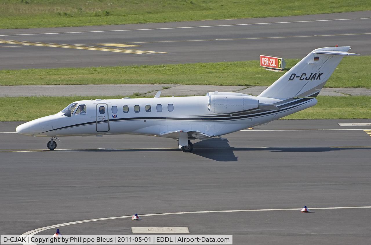 D-CJAK, 2006 Cessna 525B CitationJet CJ3 C/N 525B-0075, Taxiing on taxiway Mike in front of terminal B.