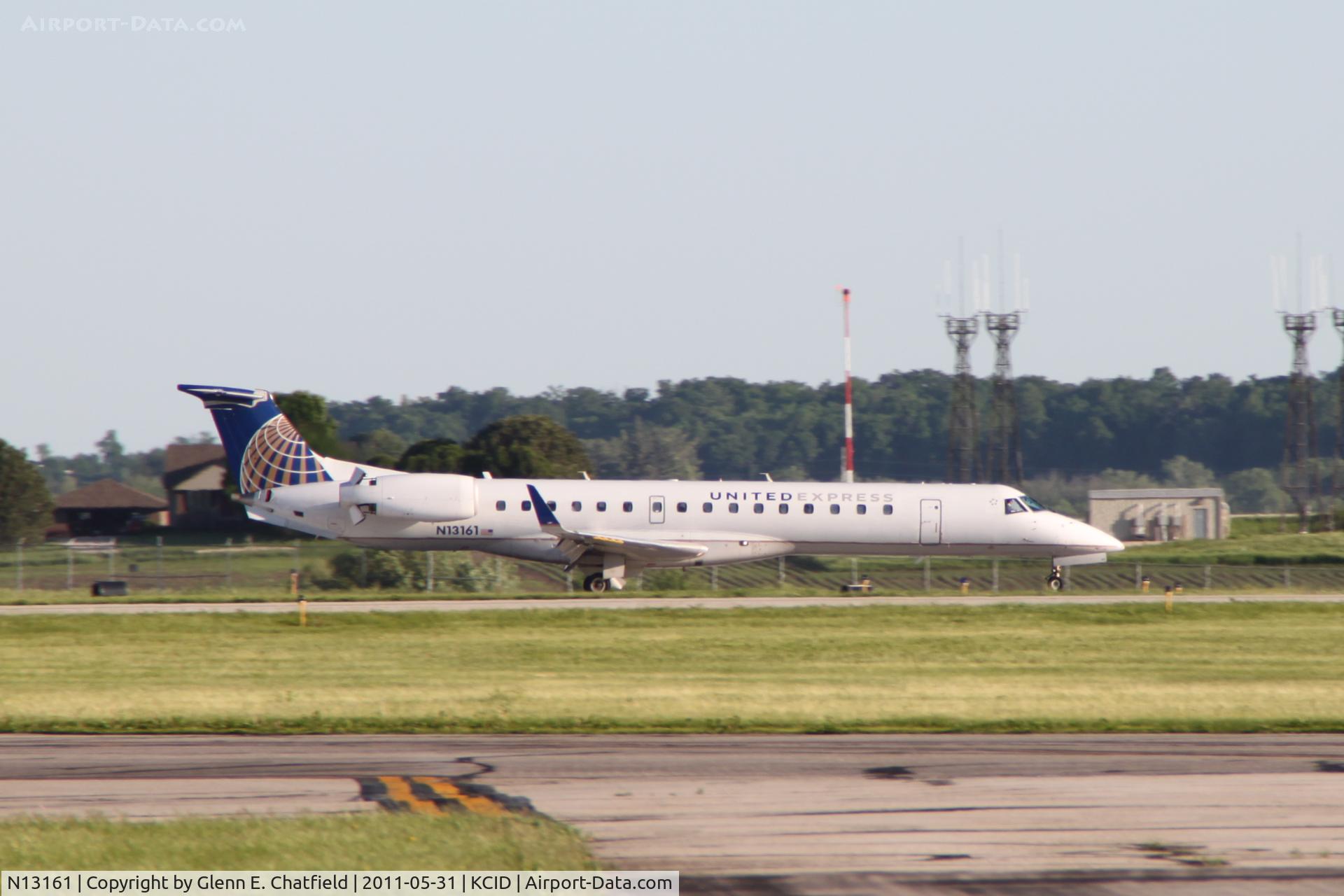 N13161, 2004 Embraer ERJ-145XR (EMB-145XR) C/N 14500805, Rolling out on runway 27, photographed from the Collins ramp