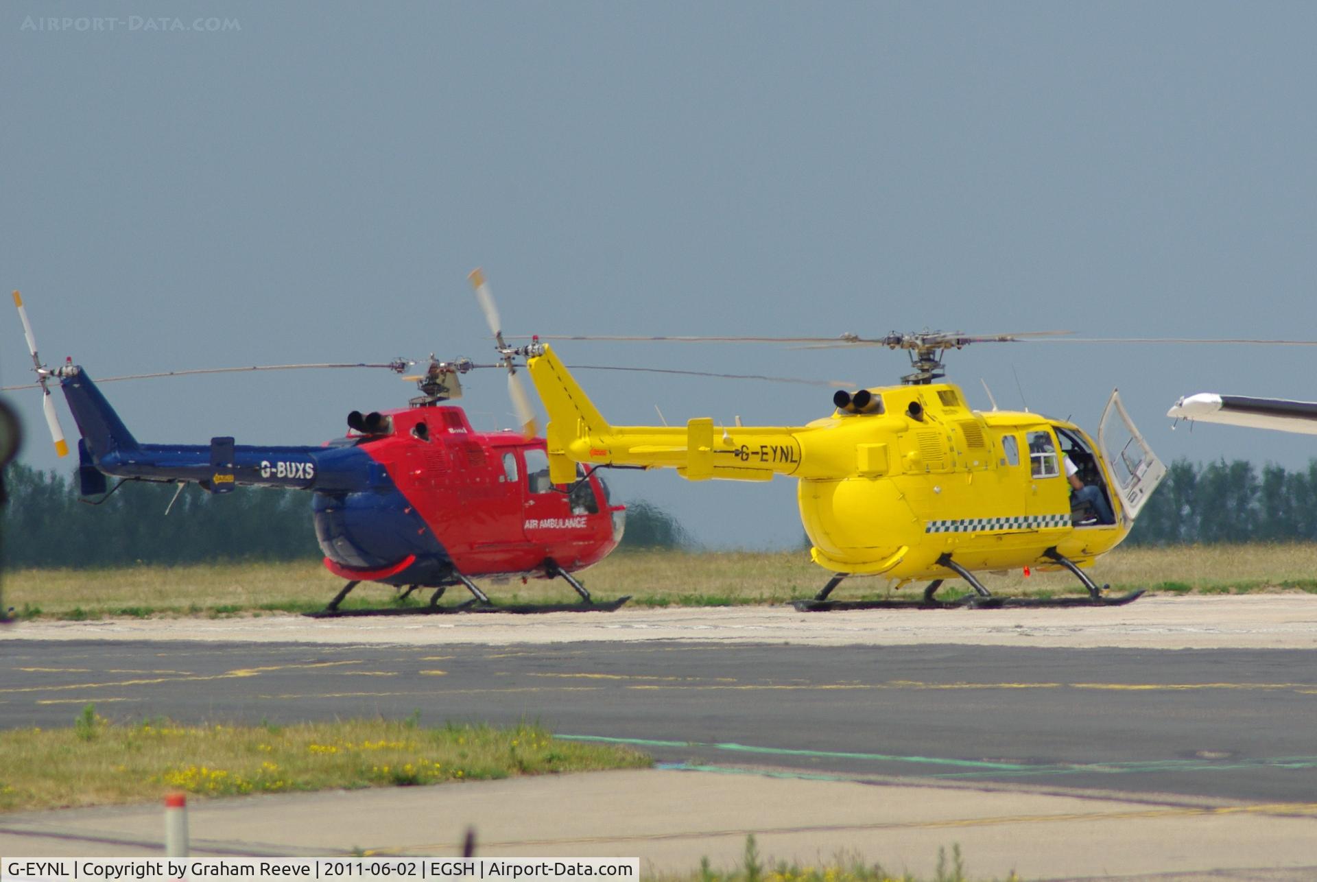 G-EYNL, 1979 MBB Bo-105DBS-5 C/N S.382, With G-BUXS in the back ground.