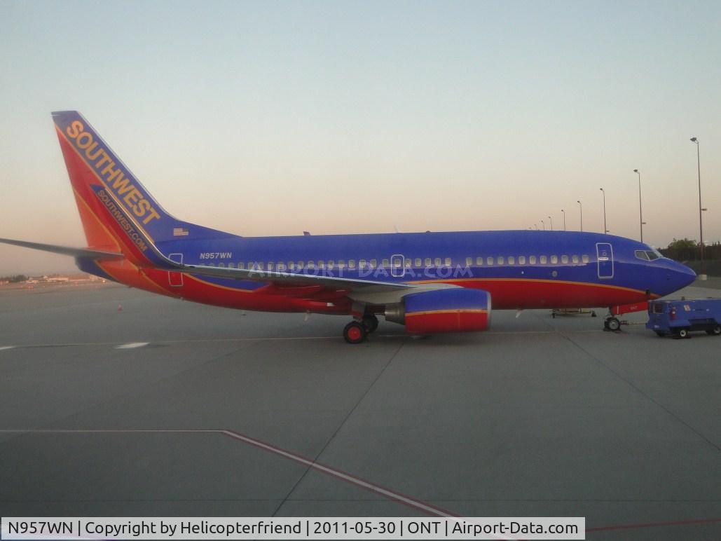 N957WN, 2011 Boeing 737-7H4 C/N 41528, Sun rising and shinning on the tail of this ship as we are being pushed back