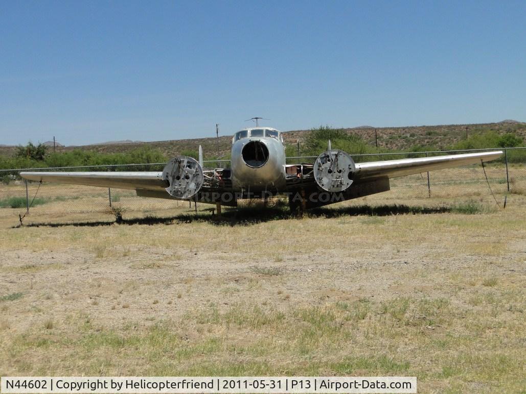 N44602, 1945 Beech D18S C/N A-10, Weathered, stripped and parked at the eastern end of the airport