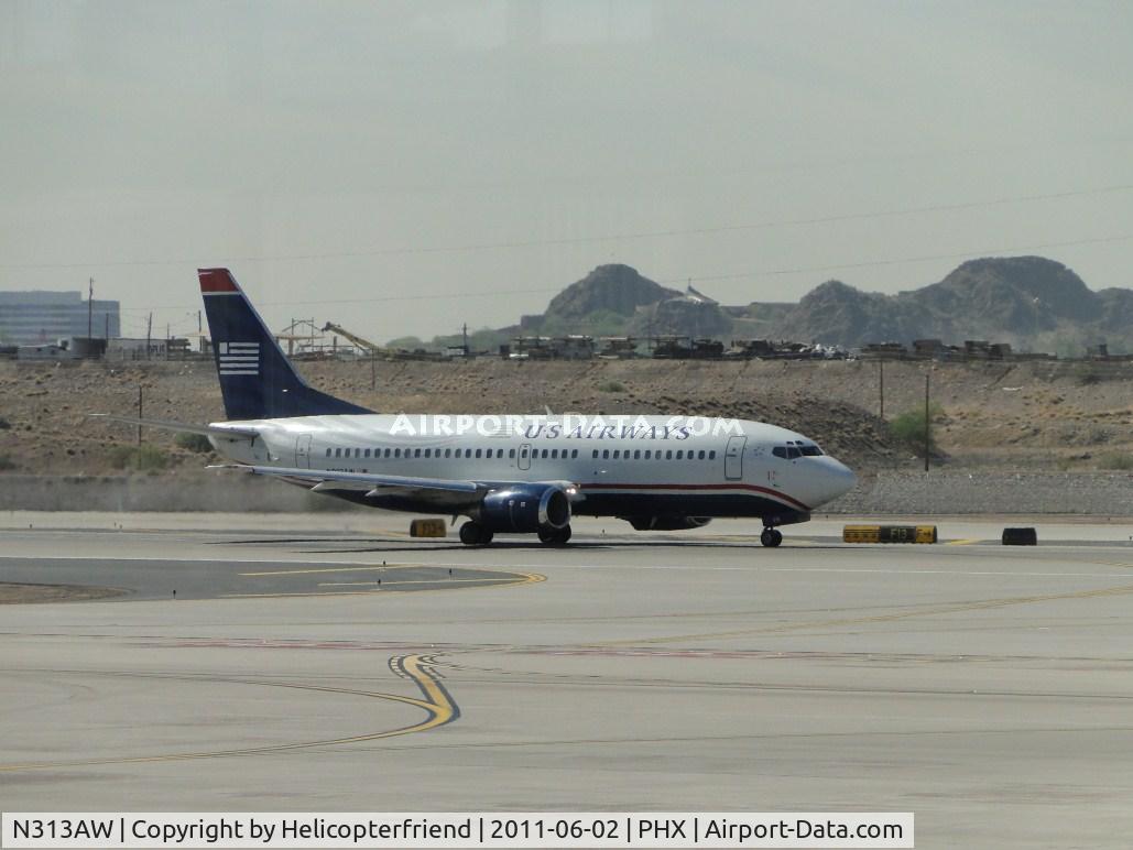 N313AW, 1987 Boeing 737-3S3 C/N 23712, Taxiing to runway 25L for take off
