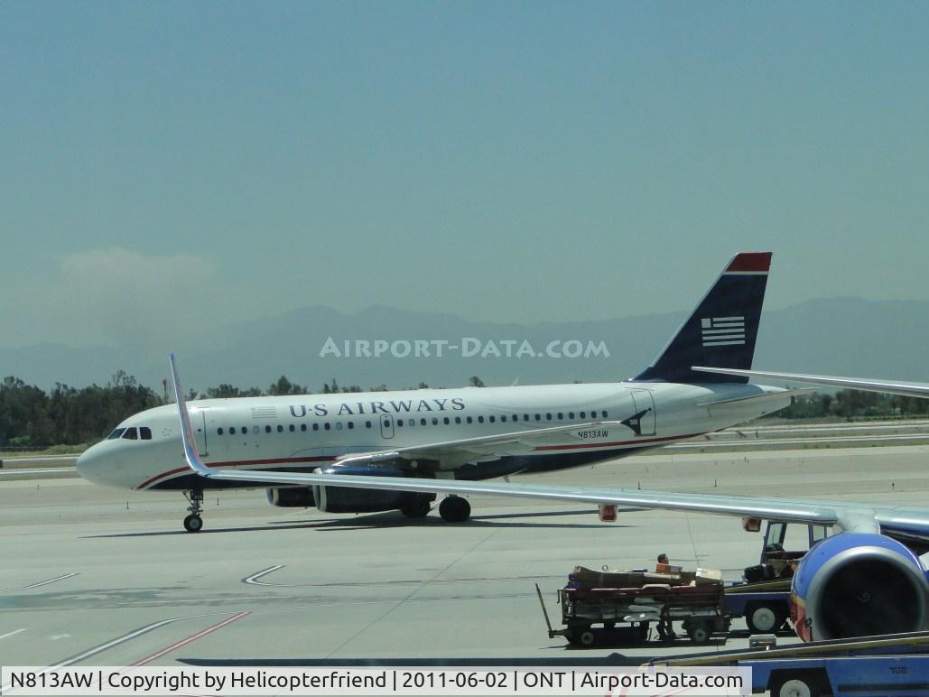 N813AW, 2000 Airbus A319-132 C/N 1223, Taxiing to runway 26R as we walk towards baggage claims