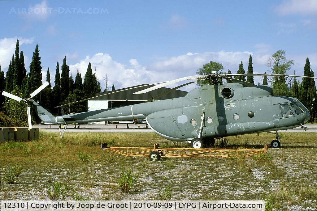12310, Mil Mi-8T C/N 0000, After the separation of Serbia and Montenegro this Mi-8 was transferred to the Montenegrin AF. They did not take it on charge, so it it resting in the grass near the main flight lines.