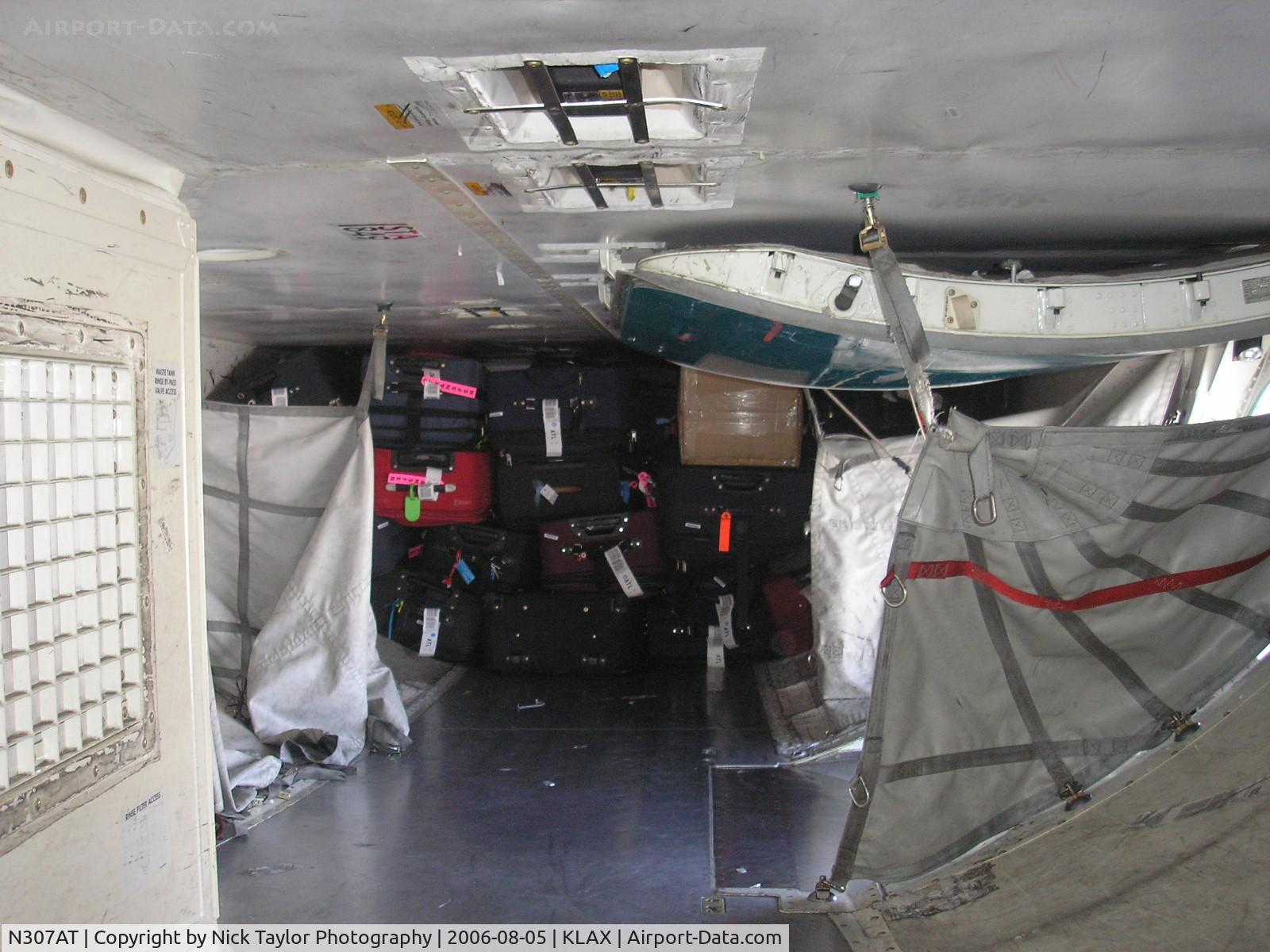 N307AT, 2006 Boeing 737-7BD C/N 34862, Stacked bags in the aft cargo hold on their way to ATL.
