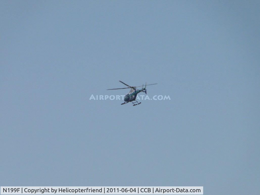 N199F, 2003 Bell 407 C/N 53574, Heading west from Cable