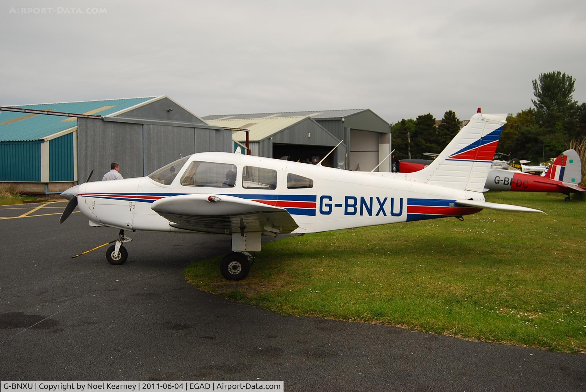 G-BNXU, 1979 Piper PA-28-161 C/N 28-7916129, Parked on the ramp - Newtownards Airfield