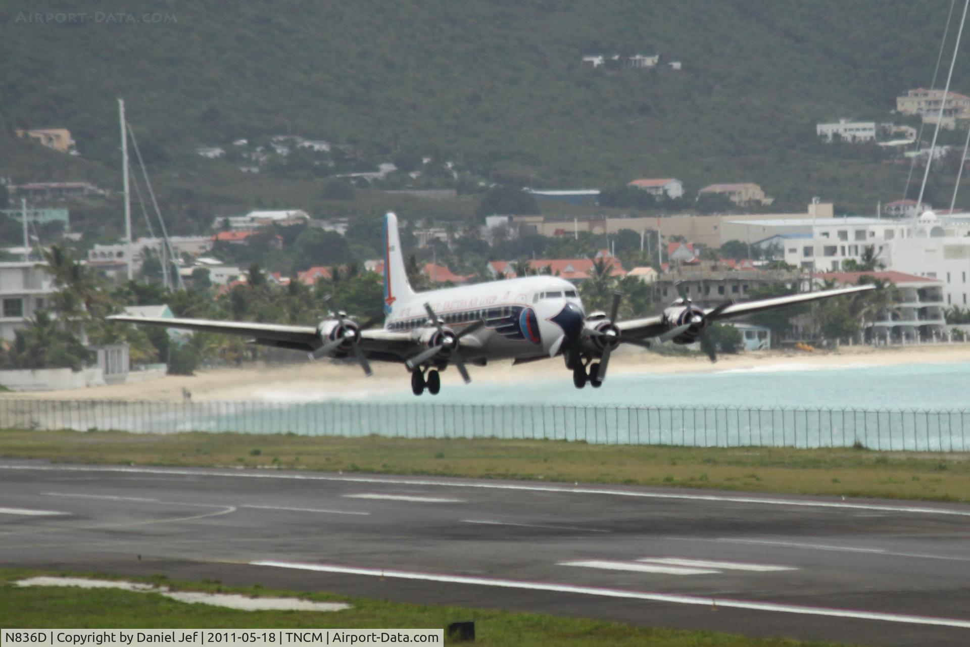 N836D, 1957 Douglas DC-7B C/N 45345, N836D taking off at TNCM runway 28