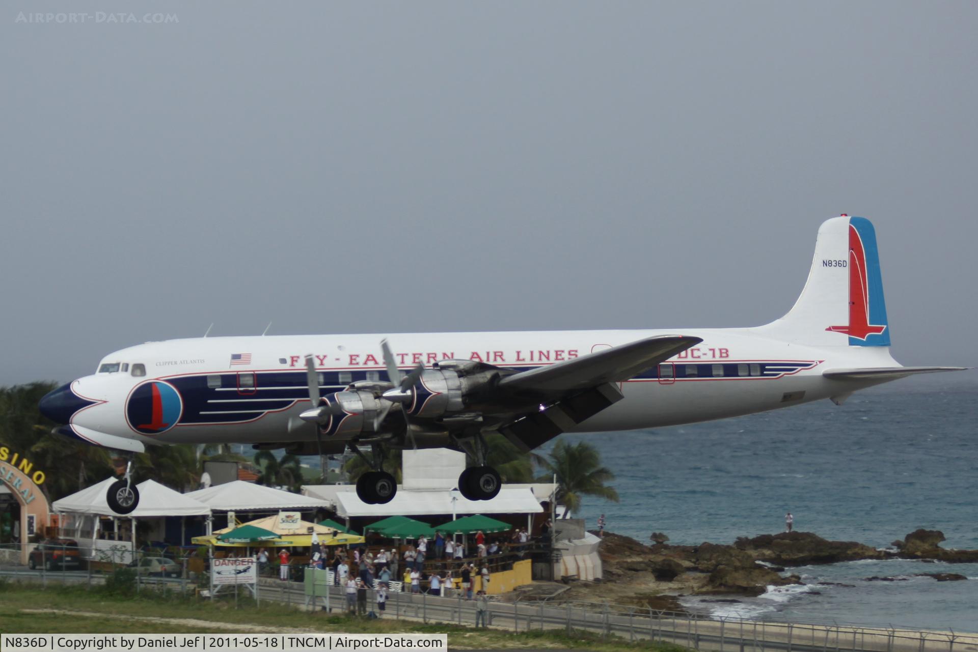 N836D, 1957 Douglas DC-7B C/N 45345, N836D over the Maho at TNCM on a rainy day!!!