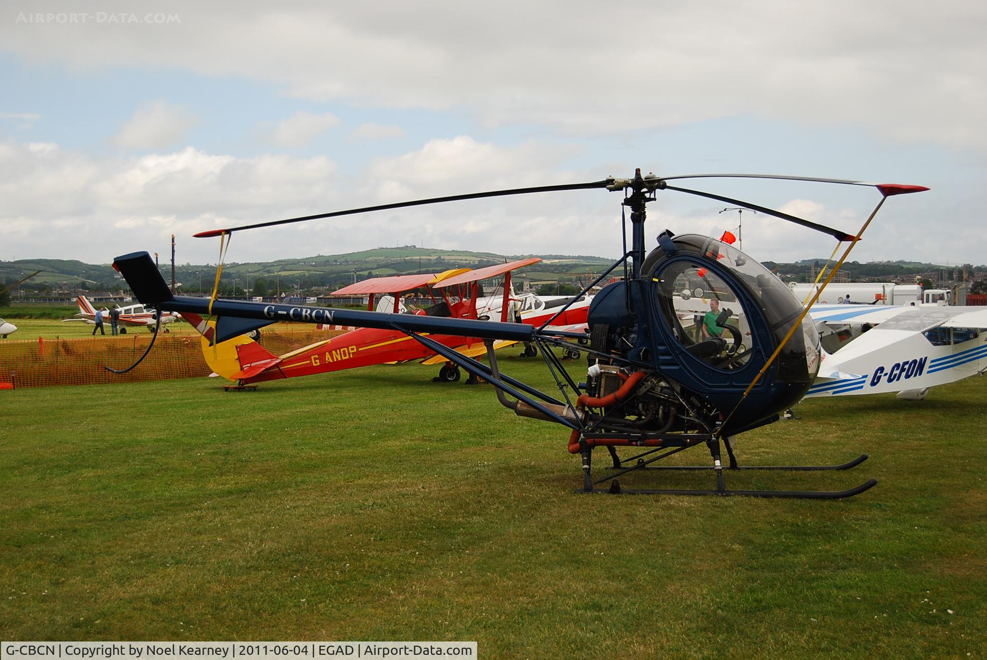 G-CBCN, 2001 Schweizer 269C-1 C/N 0129, Parked in the display area at Newtownards Airfield.