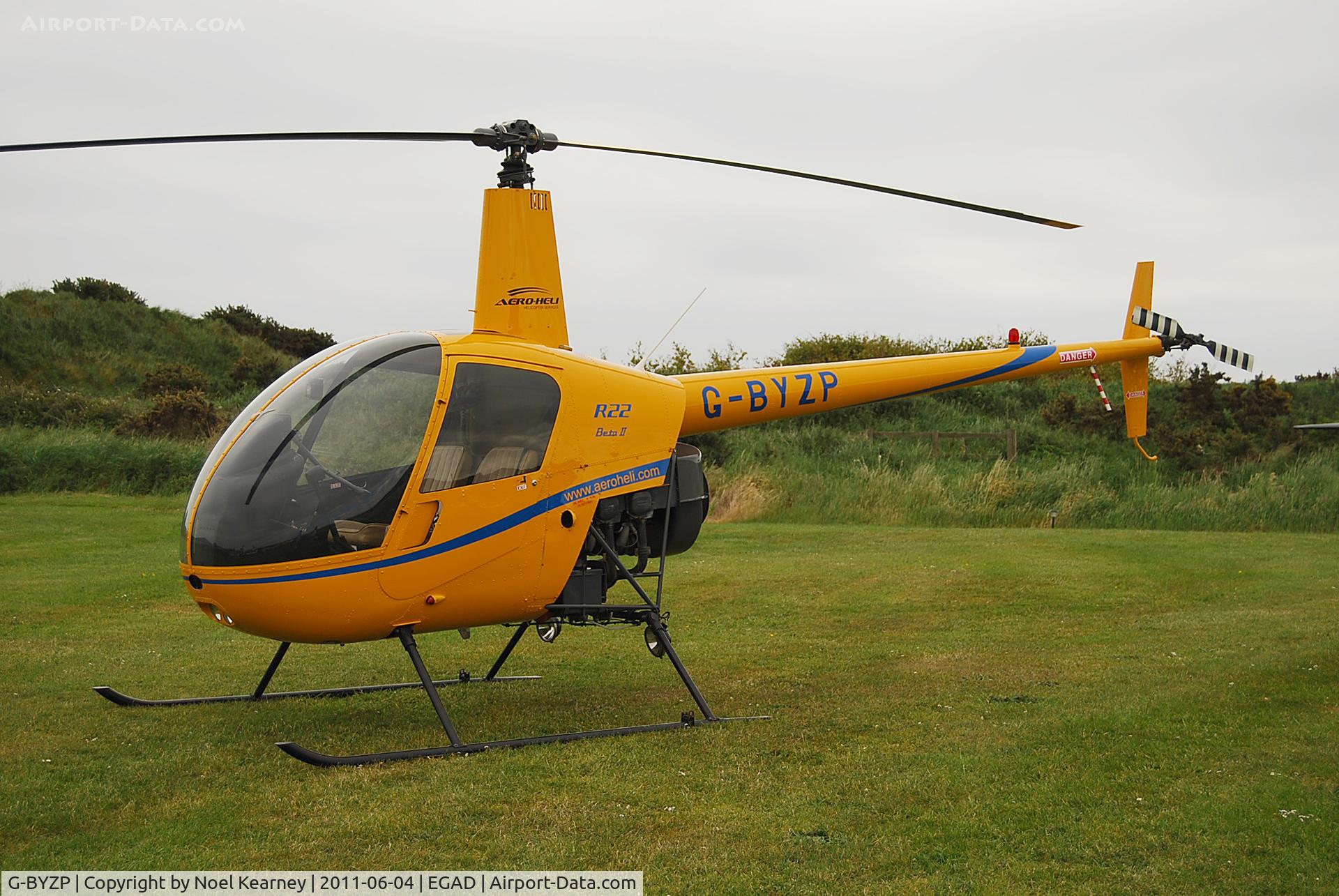 G-BYZP, 1999 Robinson R22 Beta C/N 3018, Parked in the display area at Newtownards Airfield.