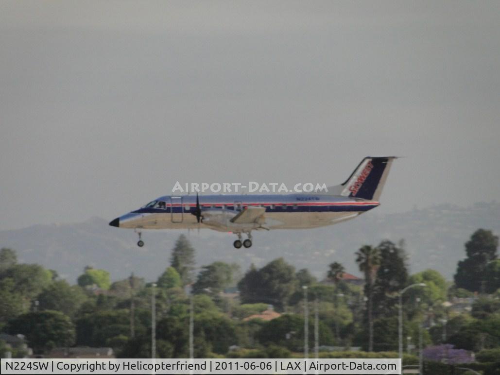N224SW, 1995 Embraer EMB-120ER Brasilia C/N 120.294, Landing on runway 24R
