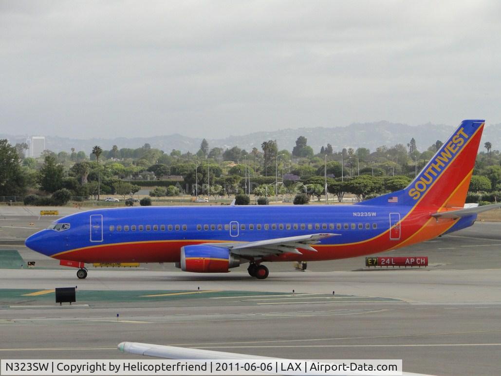 N323SW, 1987 Boeing 737-3H4 C/N 23344, Waiting to enter runway 24L for take off