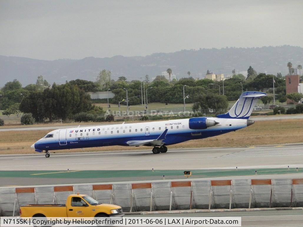 N715SK, 2004 Bombardier CRJ-700 (CL-600-2C10) Regional Jet C/N 10179, Waiting to take off on runway 24L
