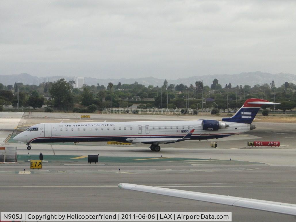 N905J, 2003 Bombardier CRJ-900 (CL-600-2D24) C/N 15005, Waiting to taxi onto runway 24L