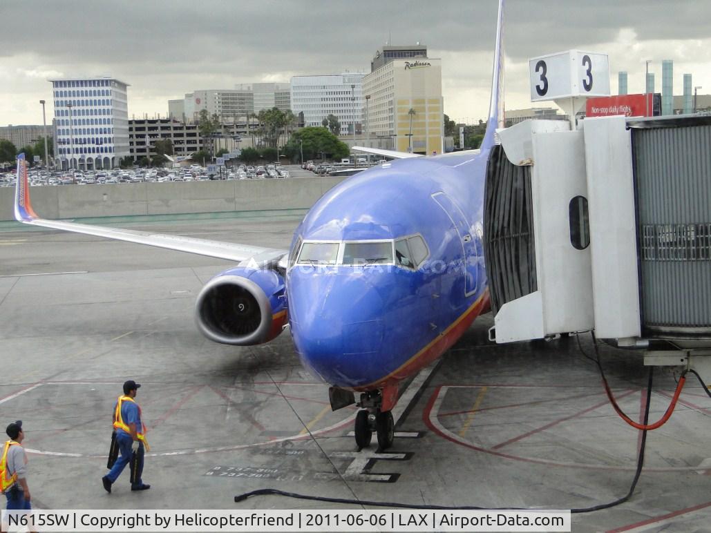 N615SW, 1995 Boeing 737-3H4 C/N 27698, Full stop, chocking the wheels, getting ready to plug in the power and move the ramp into position for passengers to disenbark, including Grand Daughter