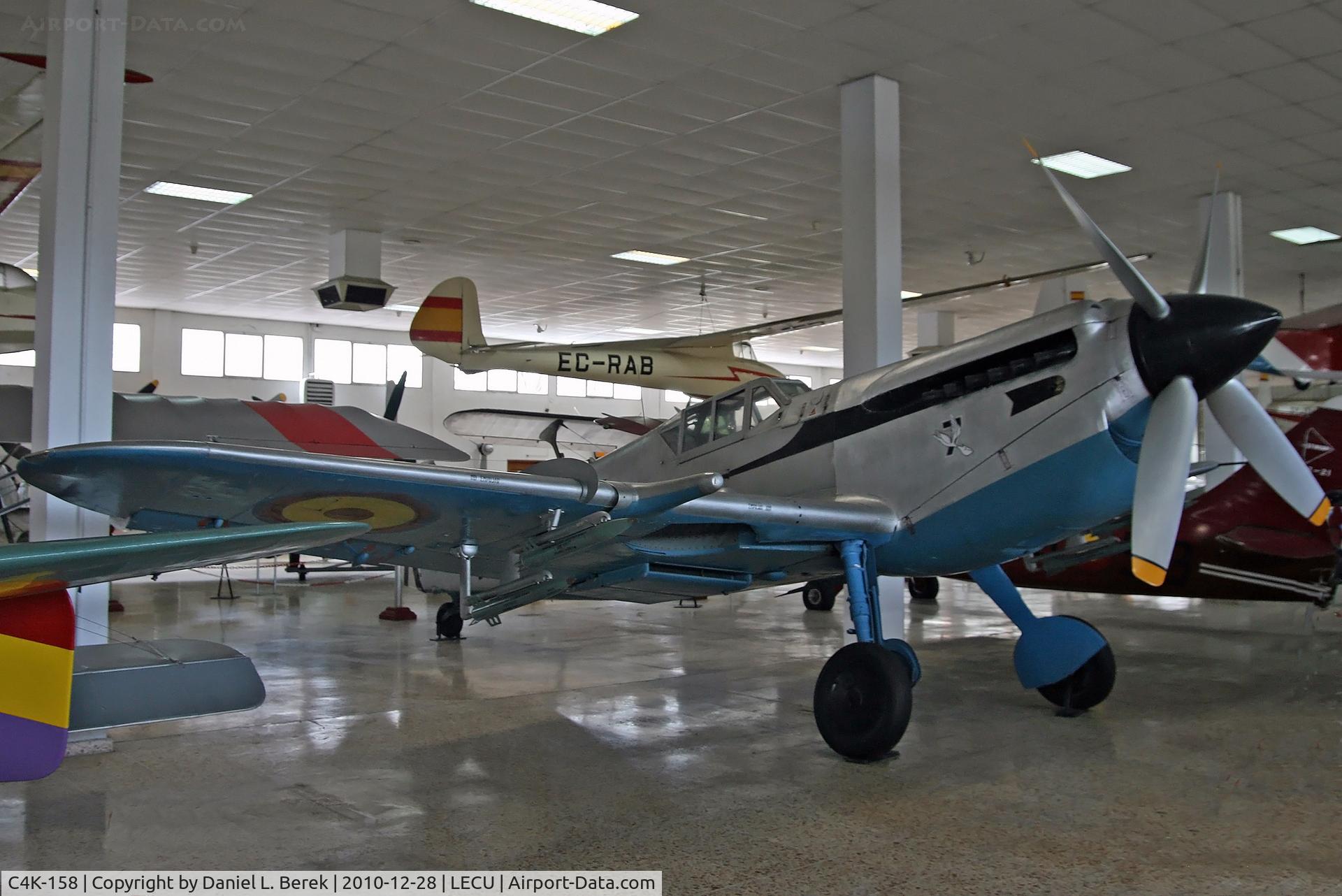 C4K-158, Hispano HA-1112-M1L Buchon C/N 211, Colorful Spanish-built Me-109, powered by a British Rolls-Royce Merlin.