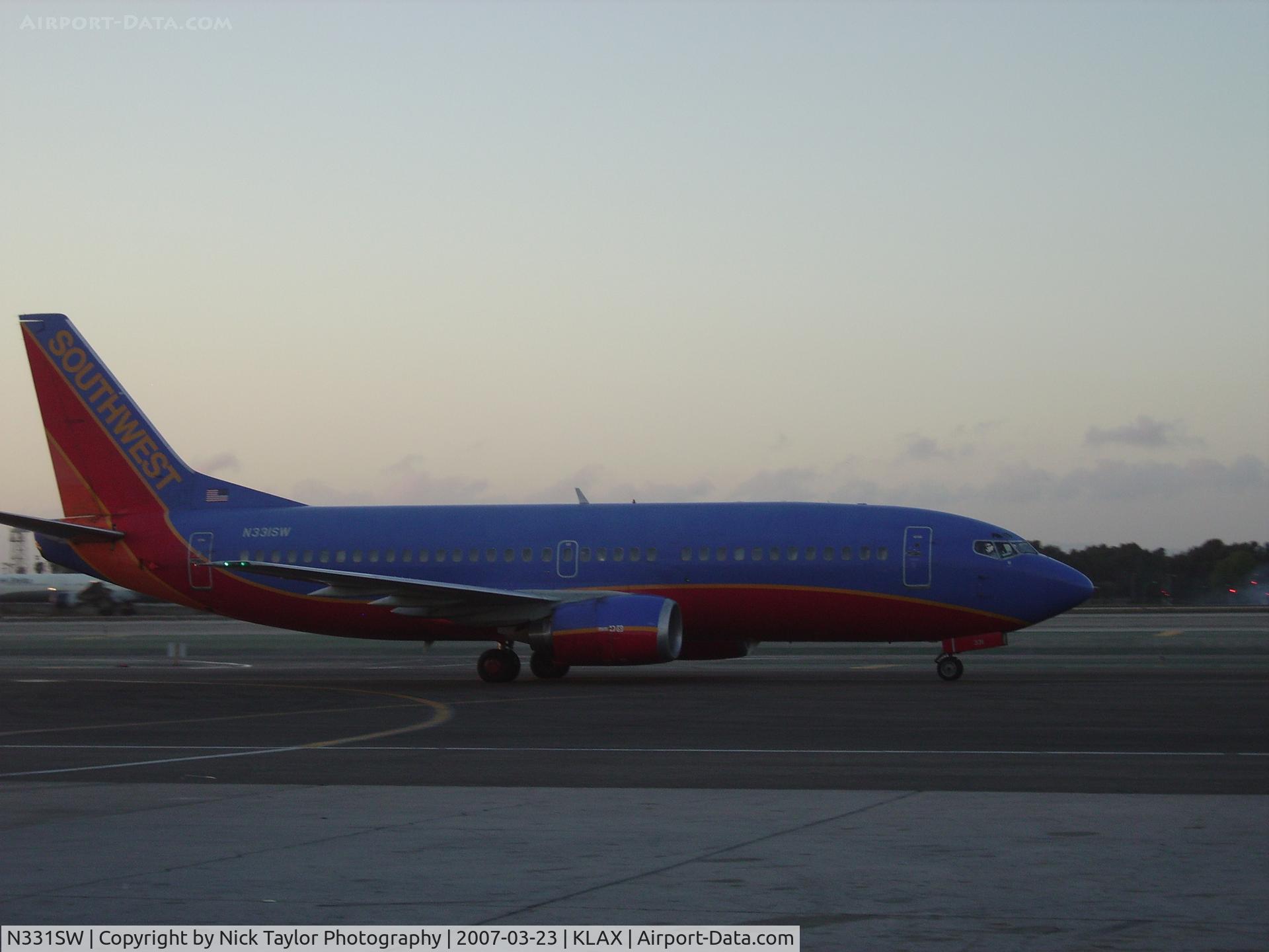 N331SW, 1988 Boeing 737-3H4 C/N 23695, Taxiing by terminal 3