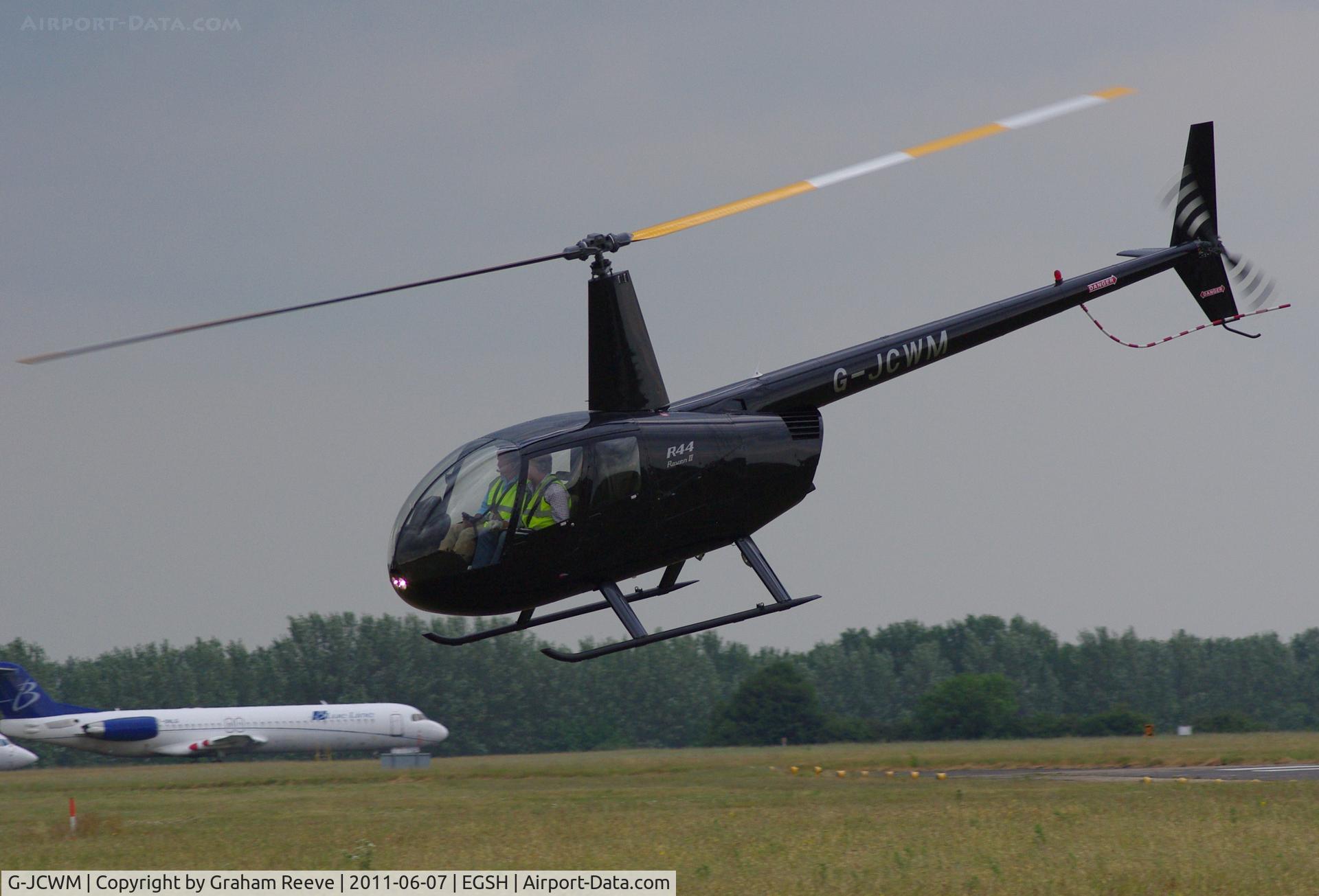 G-JCWM, Robinson R44 II C/N 11860, Departing from Norwich.