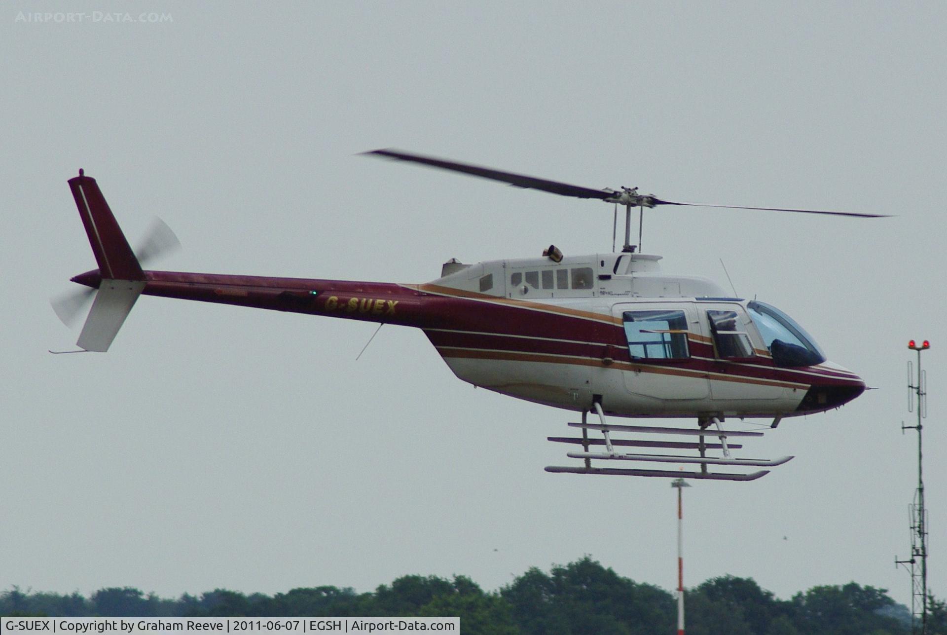 G-SUEX, 1978 Agusta AB-206B JetRanger II C/N 8567, About to touch down.