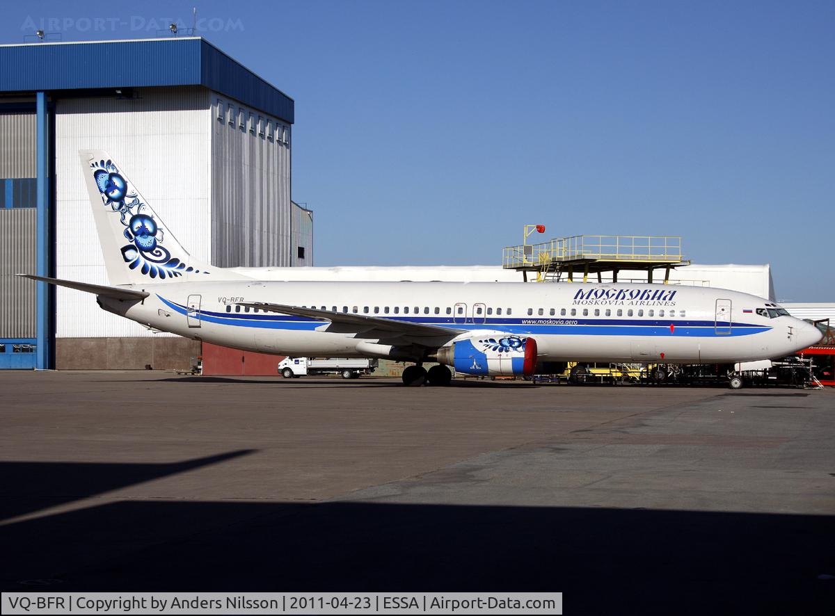 VQ-BFR, 2000 Boeing 737-883 C/N 30468, Parked at ramp H. Waiting to be stripped of tape and retaped into SAS interim colours.