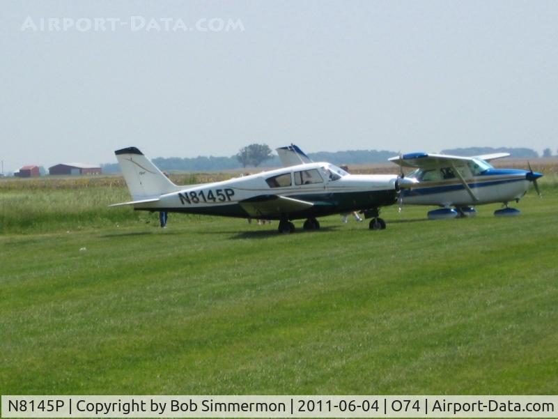 N8145P, 1963 Piper PA-24 Comanche C/N 24-3398, Parked in the grass at Mt. Victory, Ohio