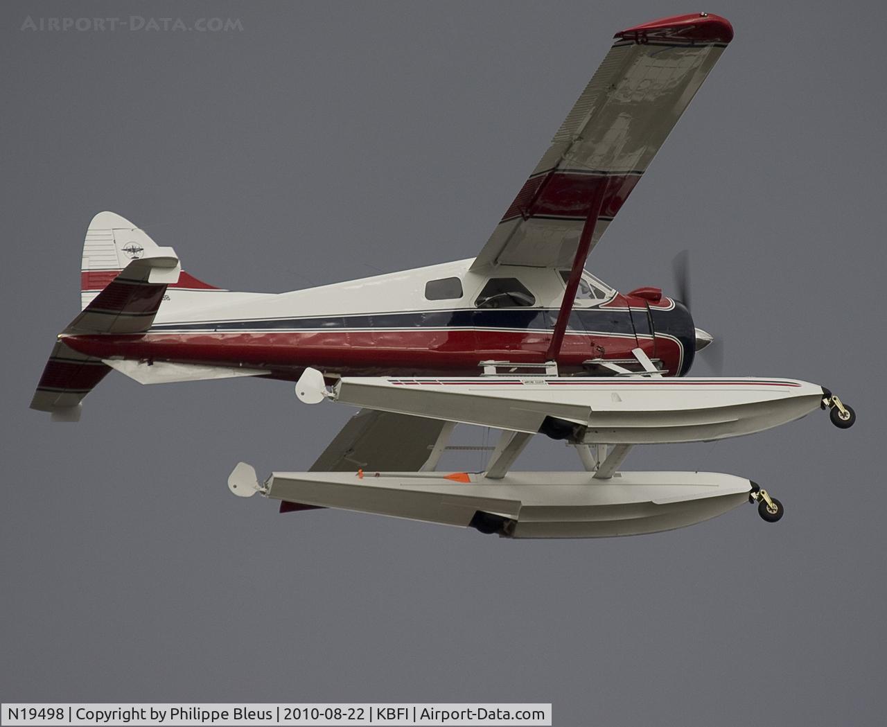 N19498, 1939 Cessna C-165 Airmaster C/N 467, Seaplane climbing from rwy 13L in very dark skies.