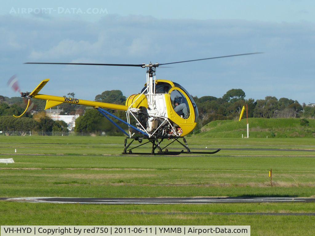 VH-HYD, 2004 Schweizer 269C-1 C/N 0179, Schweizer 269C VH-HYD hovering over the heliport preparing to depart at Moorabbin