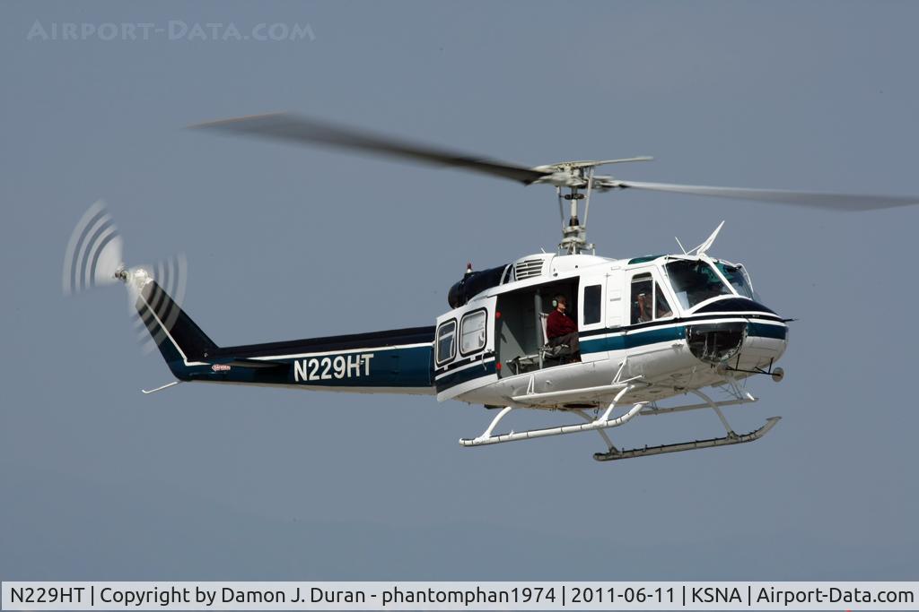 N229HT, 1980 Bell 205A-1 C/N 30330, Land to refuel.