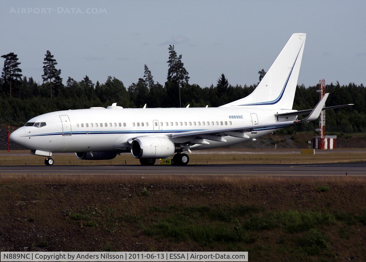 N889NC, 1999 Boeing 737-7AV C/N 30070, Taxiing on taxiway W for a departure on runway 19R.