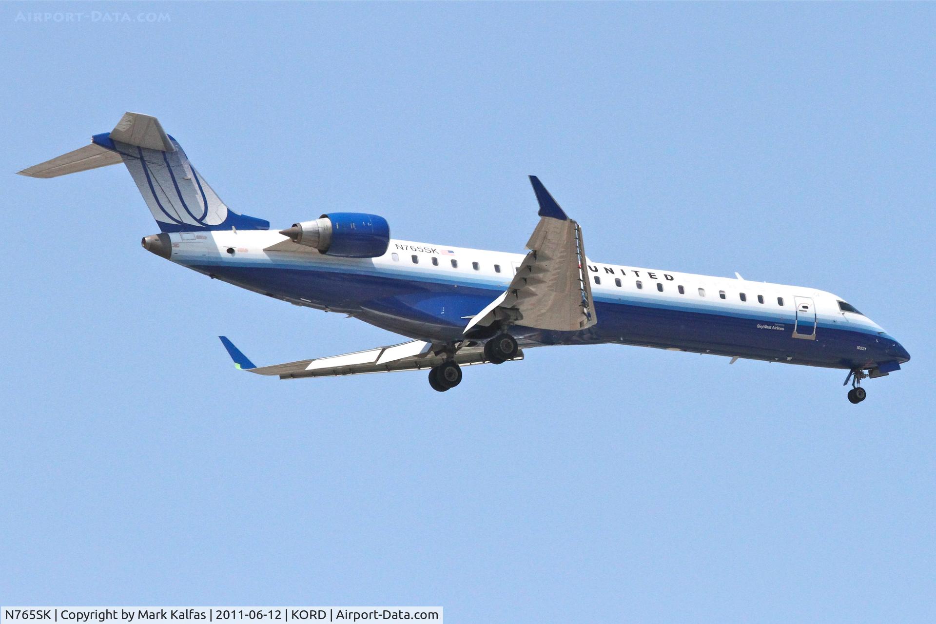 N765SK, 2005 Bombardier CRJ-702 (CL-600-2C10) Regional Jet C/N 10231, SkyWest/United Express Bombardier CL-600-2C10, SKW6487 arriving from CYYC, RWY 10 approach KORD.